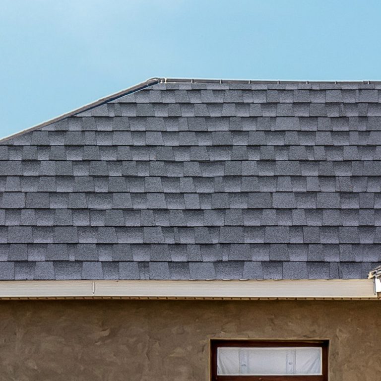Image of a repaired roof with clean, new shingles.